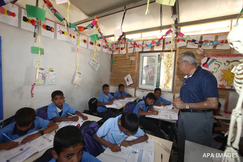 Palestinian Prime Minister Salam Fayyad speaks to press after his visit to "al-Khan al-Ahmar" school , on the first day of the new school year, in Abu Hindi valley in the bedouin, in occupied West Bank near Jericho, on S...