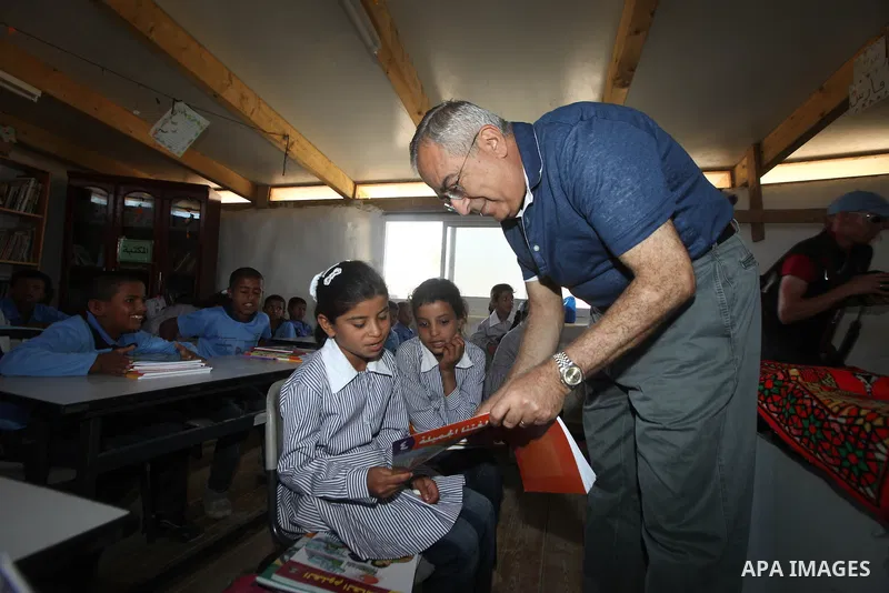 Palestinian Prime Minister Salam Fayyad speaks to press after his visit to "al-Khan al-Ahmar" school , on the first day of the new school year, in Abu Hindi valley in the bedouin, in occupied West Bank near Jericho, on S...
