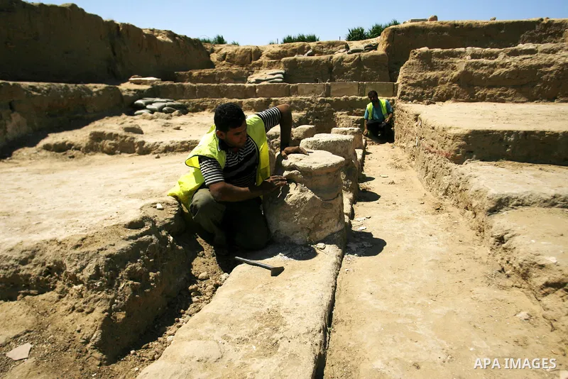 Palestinian workers do excavation in a new discovered archeological site dating back to the Iron-Age period in Rafah, southern Gaza Strip, on Aug. 30, 2012. Photo by Eyad Al Baba