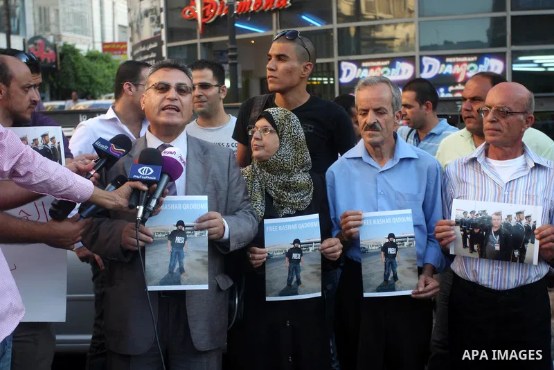 Palestinian journalists protest to demand the release of Palestinian journalist kidnapped Bashar Qaddoumi in Syria, in the West Bank city of Ramallah September 4, 2012. Photo by Issam Rimawi