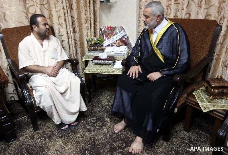 Ismail Haniya, the head of the Hamas government in the Gaza Strip, receives the family of the martyr Ihab Abu Nada in Gaza City on September 5, 2012. The death of a young Gaza man who set himself on fire because he could...