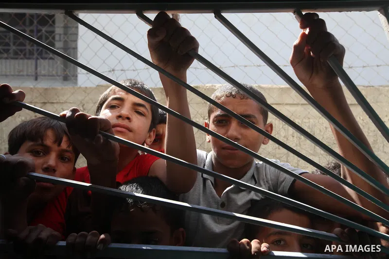 Palestinian relatives of Ihab and Akram al-Zaanin, two brothers who were killed by Israeli fire in the northern Gaza Strip, mourn their death on September 6, 2012. Three Palestinians were killed by Israeli fire in the no...