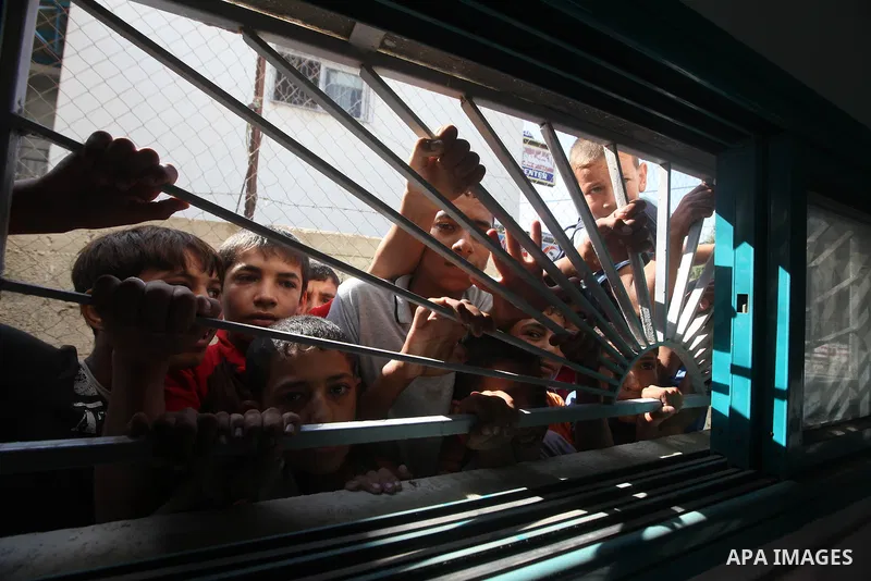 Palestinian relatives of Ihab and Akram al-Zaanin, two brothers who were killed by Israeli fire in the northern Gaza Strip, mourn their death on September 6, 2012. Three Palestinians were killed by Israeli fire in the no...