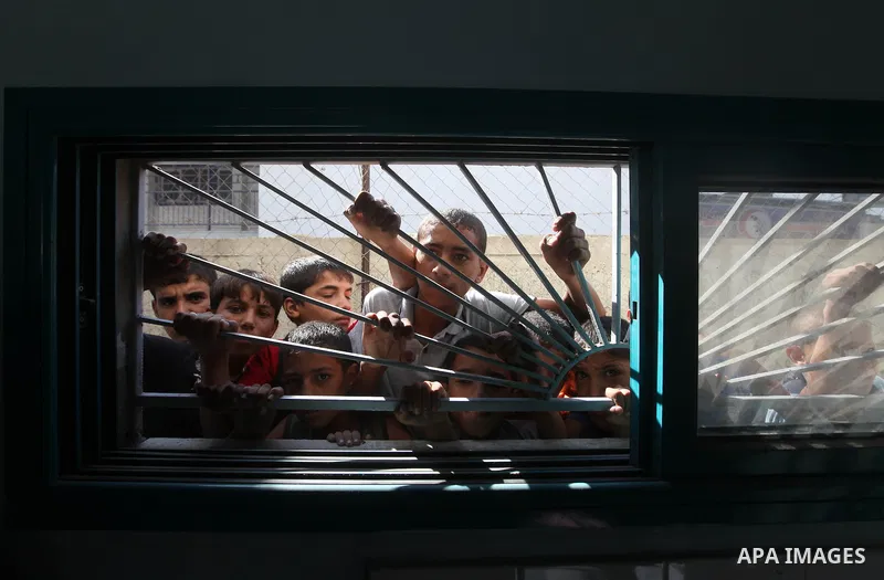 Palestinian relatives of Ihab and Akram al-Zaanin, two brothers who were killed by Israeli fire in the northern Gaza Strip, mourn their death on September 6, 2012. Three Palestinians were killed by Israeli fire in the no...