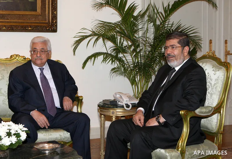 Palestinian President Mahmoud Abbas (Abu Mazen) meets with Egyptian President Mohamed Morsi in Cairo, on Sep. 06, 2012. Photo by Thaer Ganaim