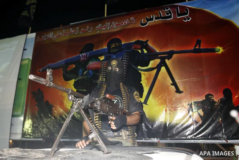 Militants from the Al-Quds Brigades march on patrol in a street in Rafah, southern Gaza strip, on September 6, 2012. An Israeli air strike on the Hamas-governed Gaza Strip killed three gunmen, one of them Al-Geram, as th...