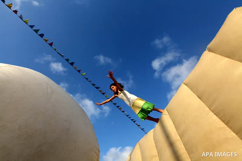 Palestinian children enjoy jump in an amusement Si Lamy park southern Gaza Strip on Sep. 07, 2012. Photo by Majdi Fathi