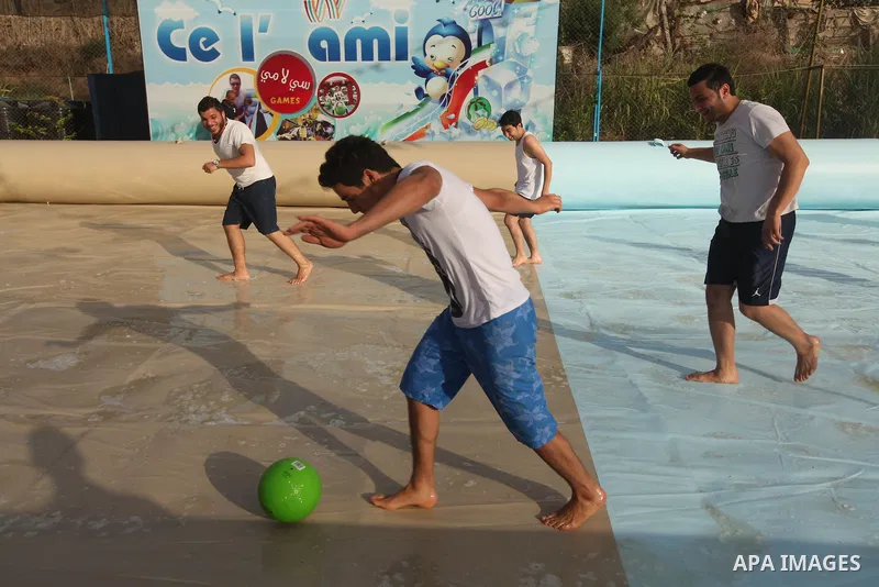 Palestinian youths enjoy play foot ball in an amusement Si Lamy park southern Gaza Strip on Sep. 07, 2012. Photo by Majdi Fathi