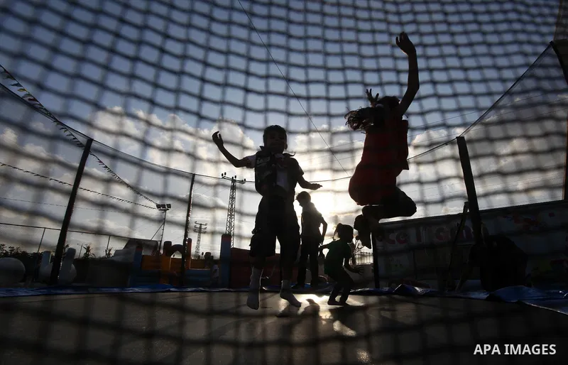 Palestinian children enjoy jump in an amusement Si Lamy park southern Gaza Strip on Sep. 07, 2012. Photo by Majdi Fathi