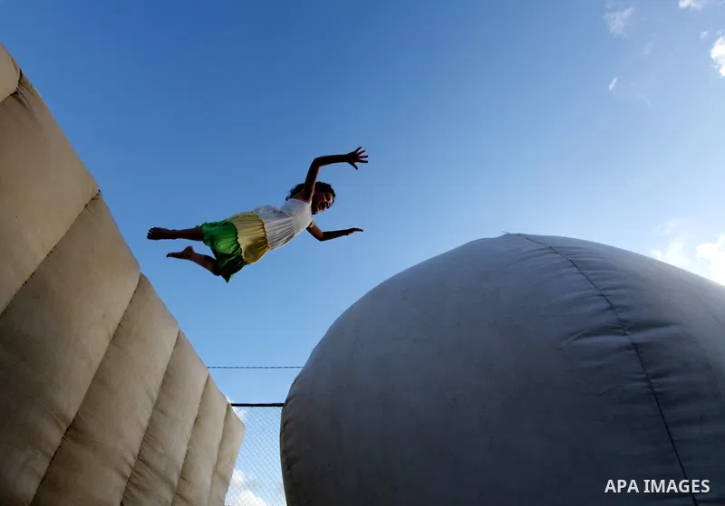 Palestinian children enjoy jump in an amusement Si Lamy park southern Gaza Strip on Sep. 07, 2012. Photo by Majdi Fathi