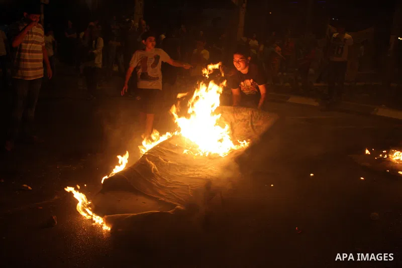Palestinians youth burn tyres during a protest against the high cost of living at Al-Amari refugee camp in the West Bank city of Ramallah on September 8, 2012. Dozens of Palestinians burned tyres and blocked the road int...