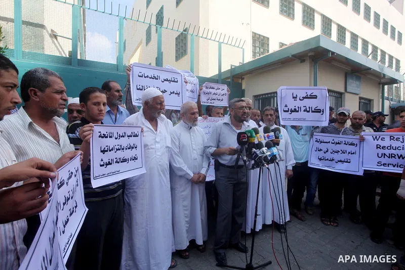 Palestinians take part in a protest against unemployment and the economic situation in the Gaza Strip, in front of the UNRWA headquarters in Gaza city on Sep. 09, 2012. Photo by Ashraf Amra