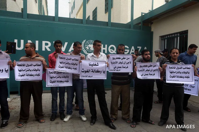 Palestinians take part in a protest against unemployment and the economic situation in the Gaza Strip, in front of the UNRWA headquarters in Gaza city on Sep. 09, 2012. Photo by Ashraf Amra
