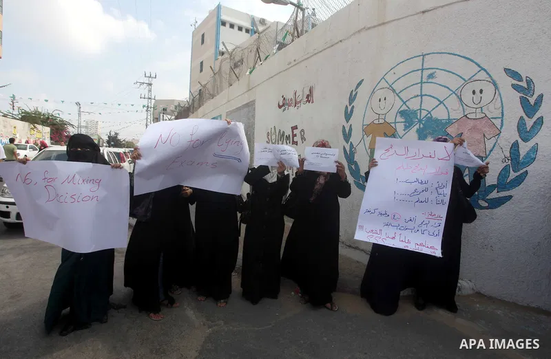 Palestinians take part in a protest against unemployment and the economic situation in the Gaza Strip, in front of the UNRWA headquarters in Gaza city on Sep. 09, 2012. Photo by Ashraf Amra