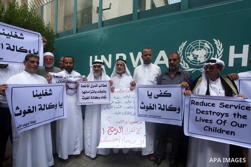 Palestinians take part in a protest against unemployment and the economic situation in the Gaza Strip, in front of the UNRWA headquarters in Gaza city on Sep. 09, 2012. Photo by Ashraf Amra