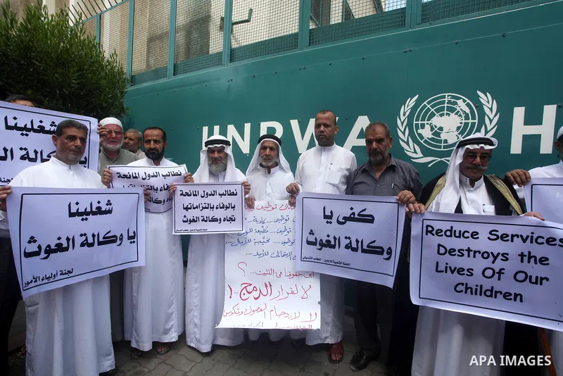 Palestinians take part in a protest against unemployment and the economic situation in the Gaza Strip, in front of the UNRWA headquarters in Gaza city on Sep. 09, 2012. Photo by Ashraf Amra