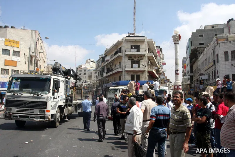 Palestinian truck drivers block a road during a protest against the high cost of living in the West Bank city of Ramallah, Sunday, Sep. 09, 2012. Photo by Issam Rimawi