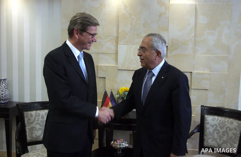 Palestinian Prime Minister Salam Fayyad (R) shakes hands with Germany's Foreign Minister Guido Westerwelle during their meeting in the West Bank city of Ramallah September 9, 2012. Westerwelle urged Iran on Sunday to bri...