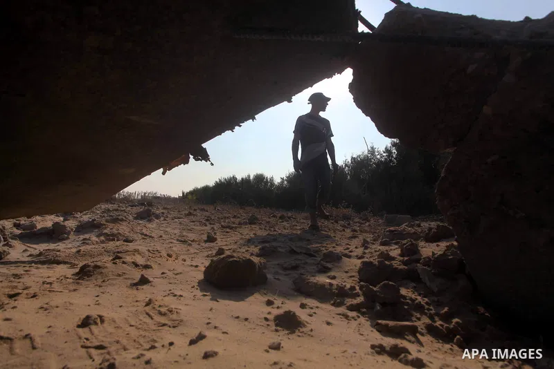 Palestinians inspect the damage to a building after an Israeli air strike in Nuseirat refugee camp in the central Gaza Strip September 10, 2012. An Israeli army statement said the Israeli air force targeted four sites in...