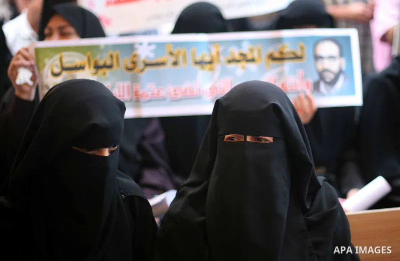 Palestinians hold a placard depicting jailed relatives during a protest in Gaza City calling for the release of Palestinian prisoners from Israeli jails September 10, 2012. Photo by Ashraf Amra