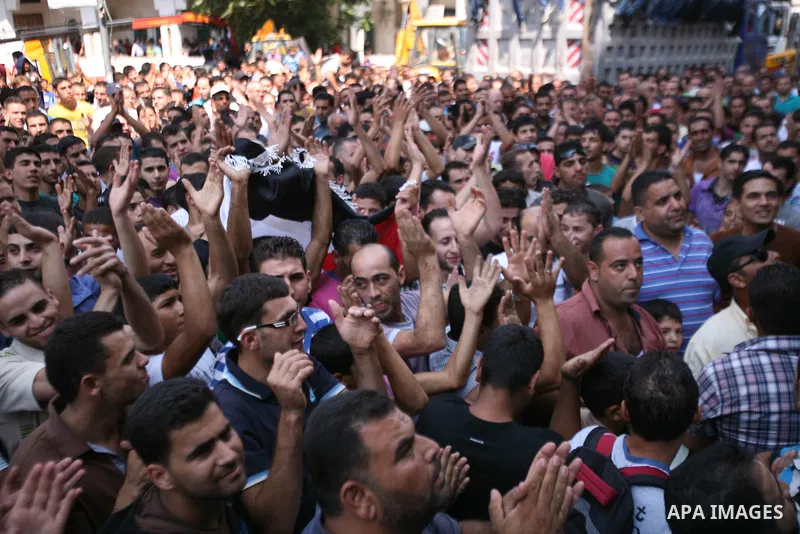 Palestinians chant slogans against Palestinian Prime Minister Salam Fayyad during a protest against the high cost of living in the West Bank city of Hebron, Monday, Sept. 10, 2012. Palestinian demonstrators fed up with h...