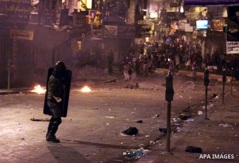 Palestinian protesters clash with police officers during a demonstration against high living costs and the government in the West Bank city of Nablus September 10, 2012. The Palestinian Authority, which governs Palestini...
