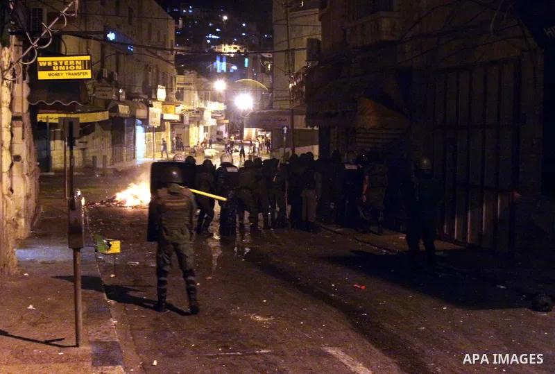 Palestinian security forces disperse crowds during clashes at a demonstration against high living costs and the government in the West Bank city of Nablus September 10, 2012. The Palestinian Authority, which governs Pale...