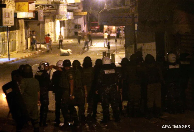 Palestinian protesters clash with police officers during a demonstration against high living costs and the government in the West Bank city of Nablus September 10, 2012. The Palestinian Authority, which governs Palestini...