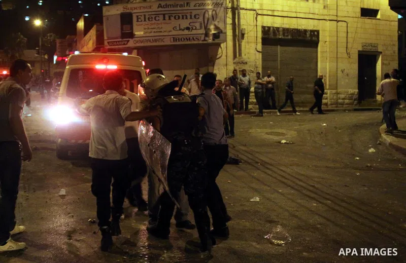 Palestinian protesters clash with police officers during a demonstration against high living costs and the government in the West Bank city of Nablus September 10, 2012. The Palestinian Authority, which governs Palestini...