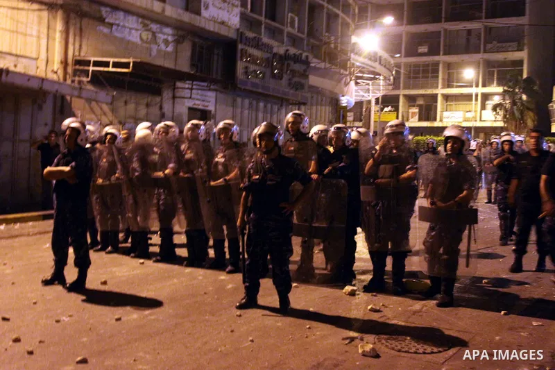 Palestinian security forces disperse crowds during clashes at a demonstration against high living costs and the government in the West Bank city of Nablus September 10, 2012. The Palestinian Authority, which governs Pale...