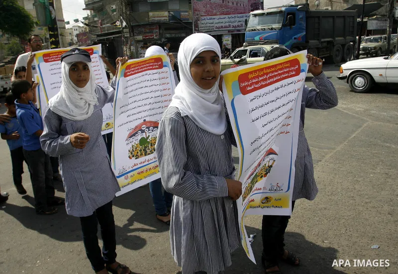 Palestinian students participate in a rally during a campaign to defend their rights in Rafah, in the southern Gaza Strip, Sep. 11, 2012. Photo by Eyad Al Baba