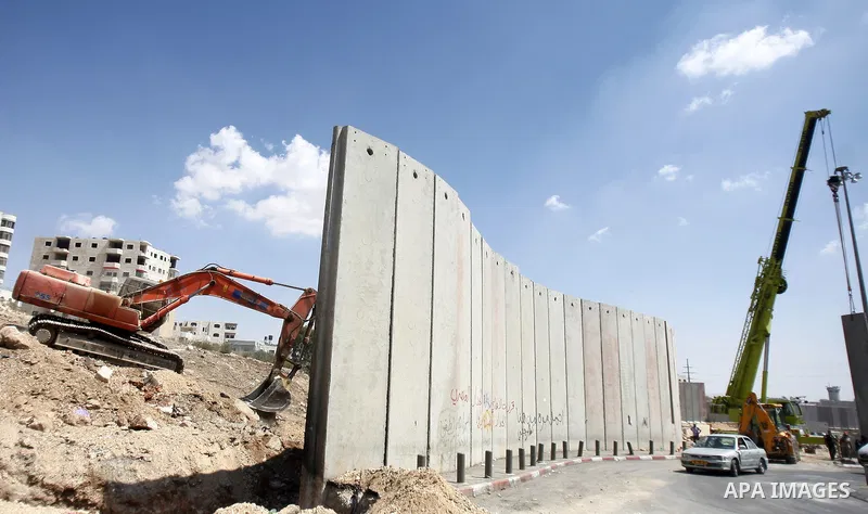 Israeli bulldozers work on the separation barrier in Shu'fat refugee camp in Jerusalem, September 11, 2012. Photo by Mahfouz Abu Turk