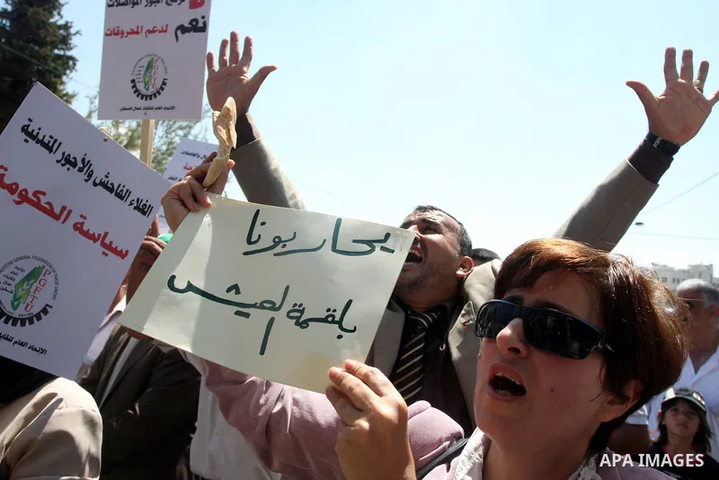 Palestinian protesters shout slogans during a demonstration against the high cost of living in the West Bank city of Ramallah, Tuesday, Sept. 11, 2012. The prime minister pledged on Tuesday that the Palestinian Authority...