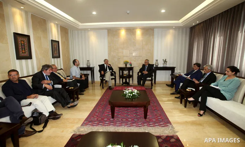Palestinian Prime Minister, Salam Fayyad, meets with Mr. Giuliano Bezabia Mayor Italian city of Milan, in thw West Bank city of Ramallah, on Sep. 12, 2012. Photo by Mustafa Abu Dayeh