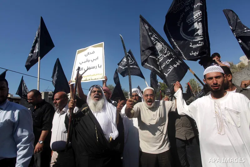 Palestinians hold swords and knifes during protest in front of the United Nations headquarters in Gaza city against the showing of a movie that is allegedly offensive to Muslim Prophet Mohammad, Sept 12, 2012. Photo by A...