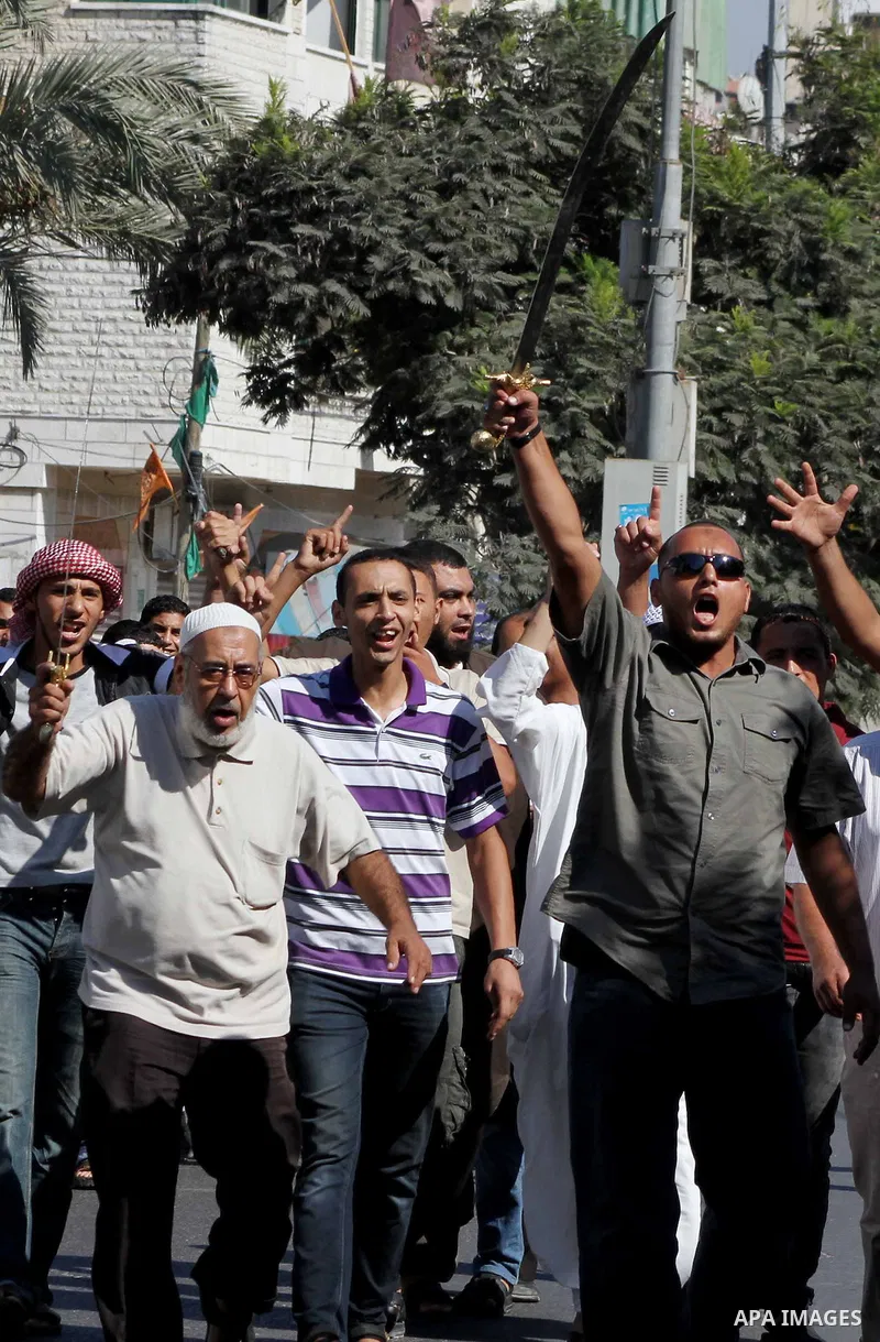 Palestinians chant during protest in front of the United Nations headquarters in Gaza city against the showing of a movie that is allegedly offensive to Muslim Prophet Mohammad, Sept 12, 2012. Photo by Ashraf Amra