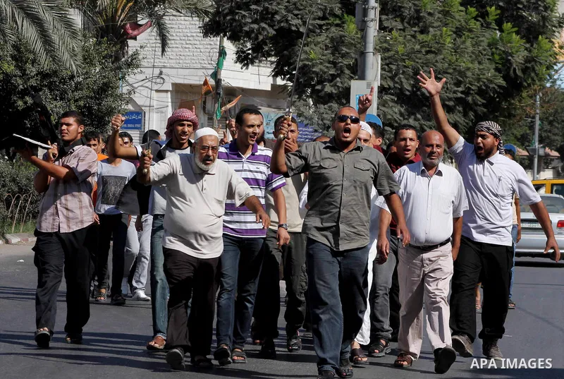 Palestinians chant during protest in front of the United Nations headquarters in Gaza city against the showing of a movie that is allegedly offensive to Muslim Prophet Mohammad, Sept 12, 2012. Photo by Ashraf Amra
