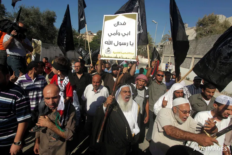 Palestinians chant during protest in front of the United Nations headquarters in Gaza city against the showing of a movie that is allegedly offensive to Muslim Prophet Mohammad, Sept 12, 2012. Photo by Ashraf Amra