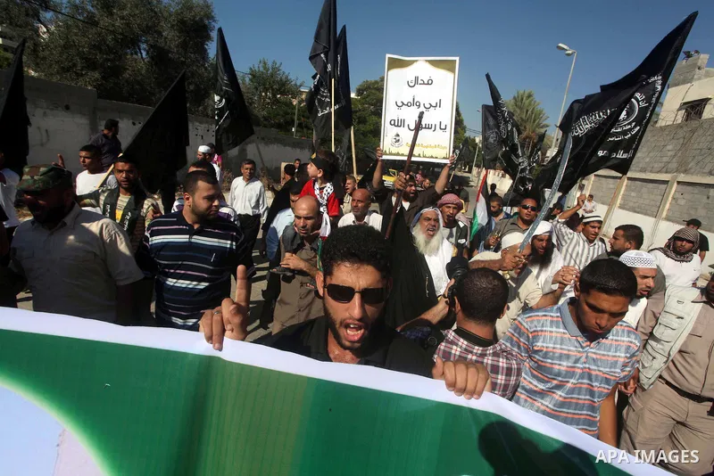 Palestinians chant during protest in front of the United Nations headquarters in Gaza city against the showing of a movie that is allegedly offensive to Muslim Prophet Mohammad, Sept 12, 2012. Photo by Ashraf Amra