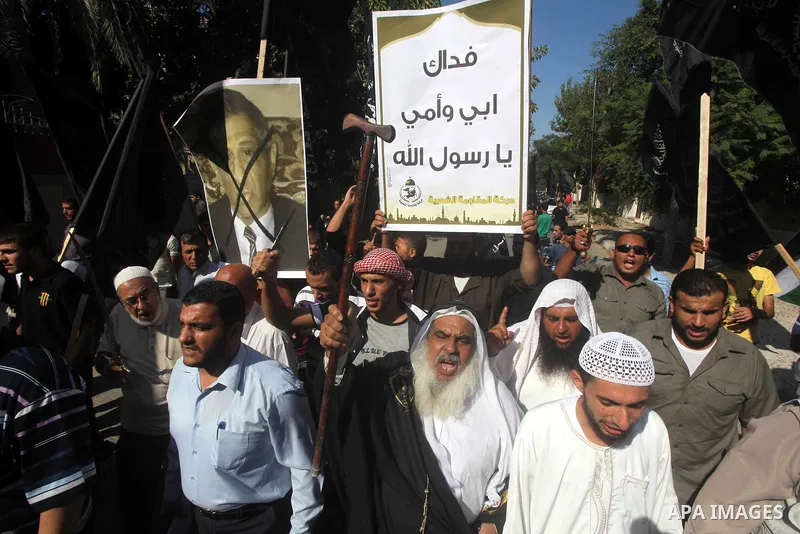 Palestinians chant during protest in front of the United Nations headquarters in Gaza city against the showing of a movie that is allegedly offensive to Muslim Prophet Mohammad, Sept 12, 2012. Photo by Ashraf Amra