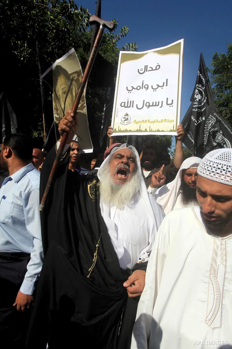 Palestinians chant during protest in front of the United Nations headquarters in Gaza city against the showing of a movie that is allegedly offensive to Muslim Prophet Mohammad, Sept 12, 2012. Photo by Ashraf Amra