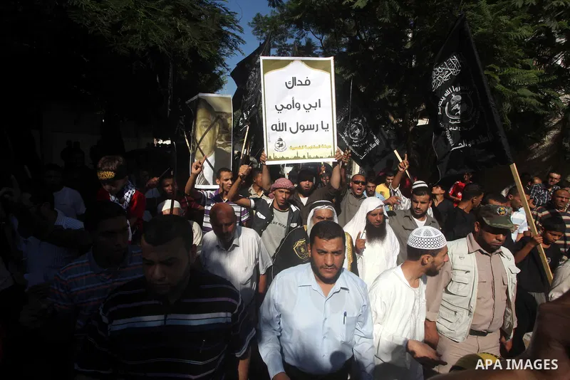 Palestinians chant during protest in front of the United Nations headquarters in Gaza city against the showing of a movie that is allegedly offensive to Muslim Prophet Mohammad, Sept 12, 2012. Photo by Ashraf Amra