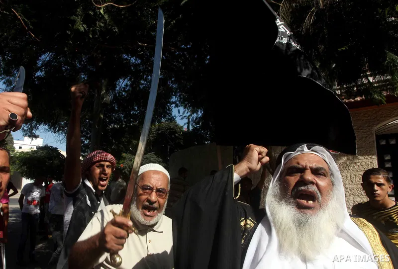 Palestinians hold swords and knifes during protest in front of the United Nations headquarters in Gaza city against the showing of a movie that is allegedly offensive to Muslim Prophet Mohammad, Sept 12, 2012. Photo by A...