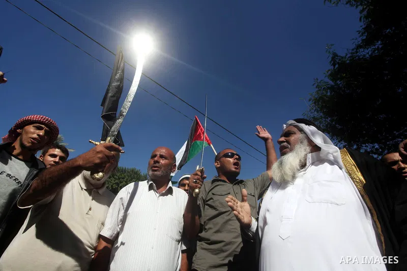 Palestinians hold swords and knifes during protest in front of the United Nations headquarters in Gaza city against the showing of a movie that is allegedly offensive to Muslim Prophet Mohammad, Sept 12, 2012. Photo by A...