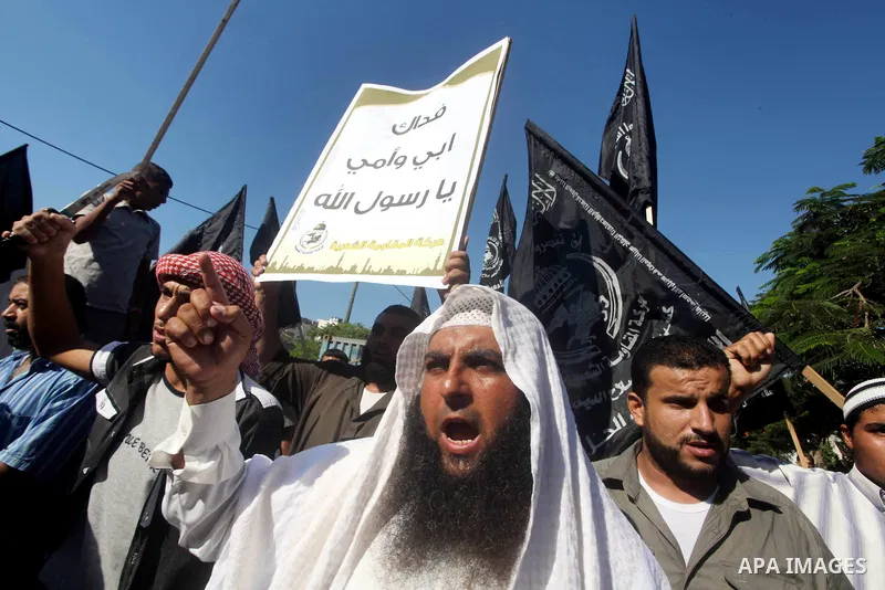 Palestinians chant during protest in front of the United Nations headquarters in Gaza city against the showing of a movie that is allegedly offensive to Muslim Prophet Mohammad, Sept 12, 2012. Photo by Ashraf Amra