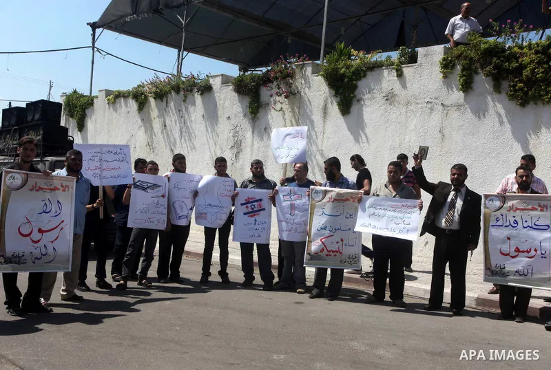 Palestinians protest against the movie, "Innocence of Muslims," in front of the Legislative Council in Gaza City, Sept. 13, 2012. Muslim anger over perceived Western insults to Islam has exploded several times, most rece...