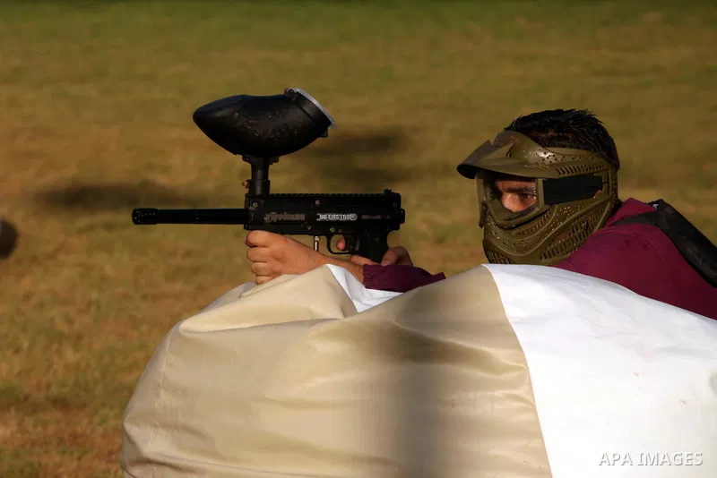 A Palestinian youth plays paintball at Si Lamy park southern Gaza Strip on Sept 13, 2012. Photo by Majdi Fathi
