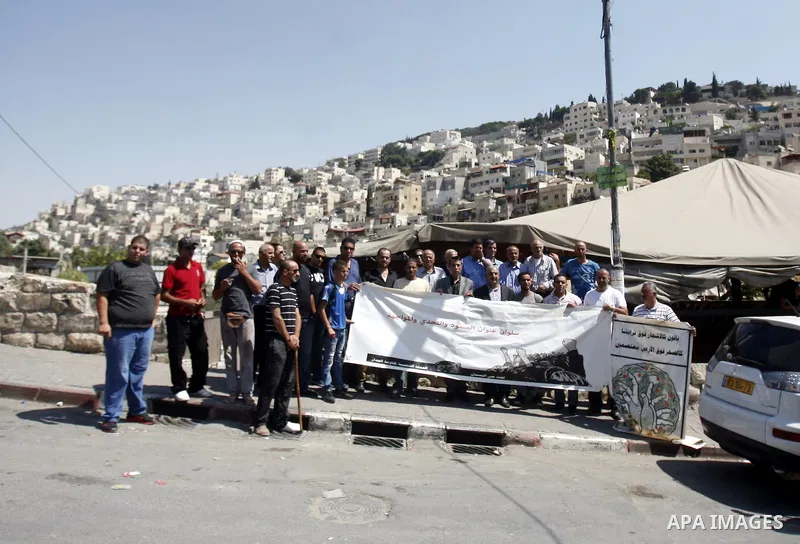 Palestinians protest against the confiscation of Palestinian lands and demolition their houses in the mostly Arab neighbourhood of Silwan in Jerusalem on Sept 13, 2012. Photo by Mahfouz Abu Turk