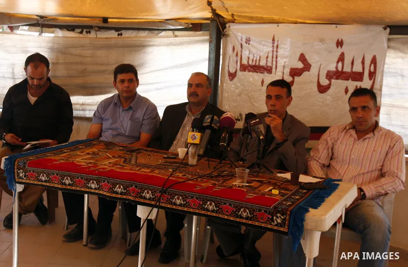 Palestinians attend a press conference against the confiscation of Palestinian lands and demolition their houses in the mostly Arab neighbourhood of Silwan in Jerusalem on Sept 13, 2012. Photo by Mahfouz Abu Turk