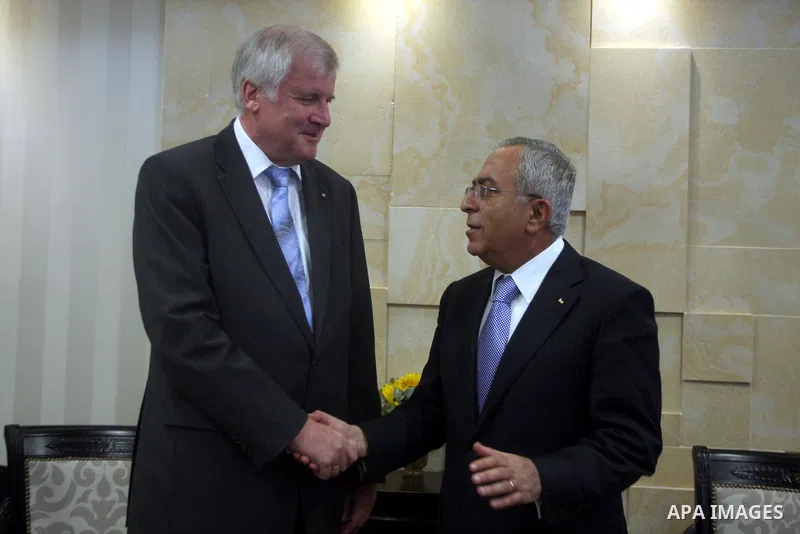 Palestinian Prime Minister Salam Fayyad, right, shakes hands with visiting Bavarian Prime Minister Horst Seehofer during a meeting in the West Bank city of Ramallah, Sept. 11, 2012. Photo by Issam Rimawi